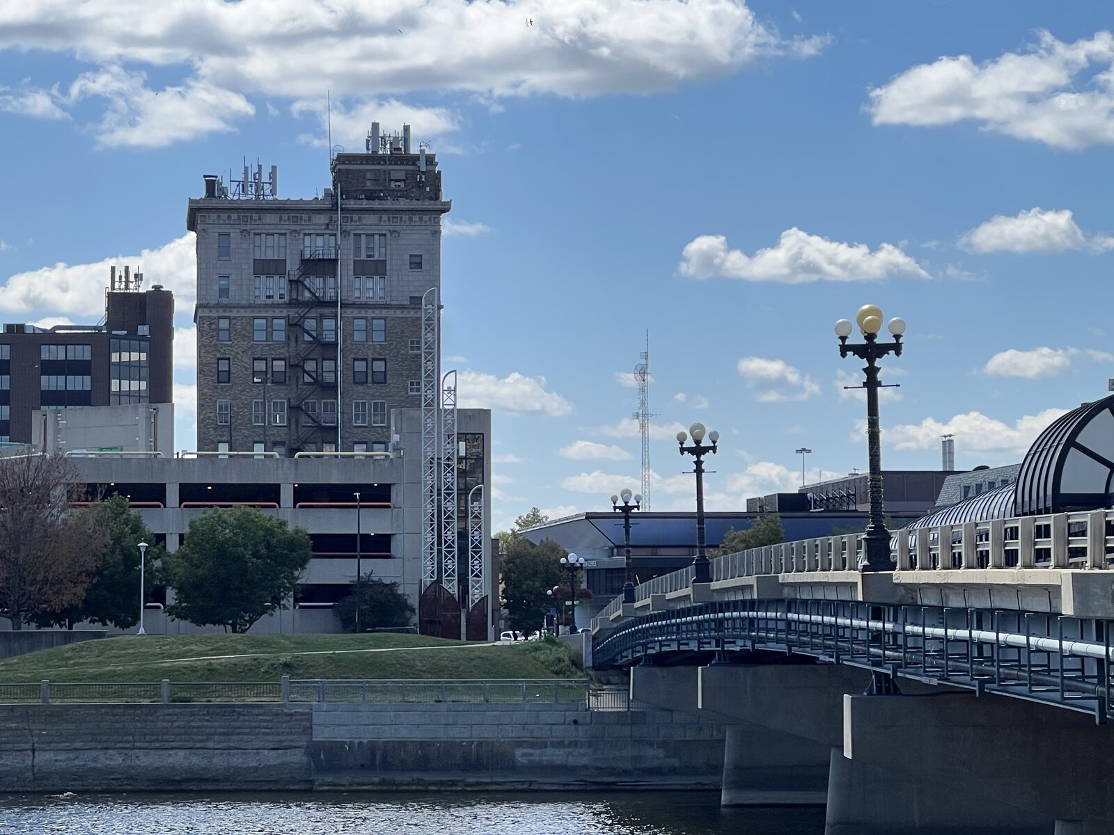 The downtown Waterloo skyline along the Cedar River, with the RiverLoop pedestrian bridge